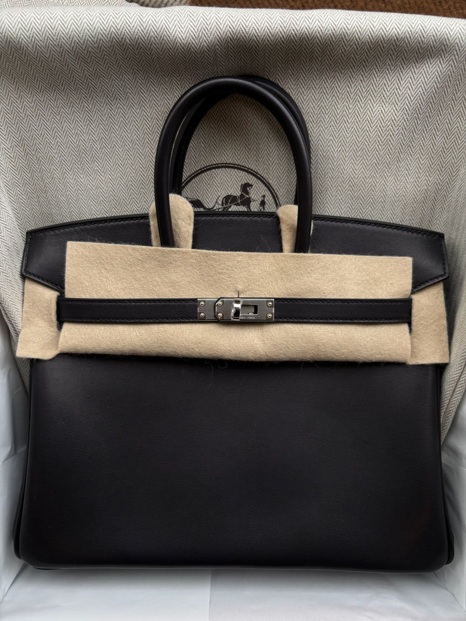 Hermès Birkin 25 in Black Veau Volupté PHW hardware — front view
