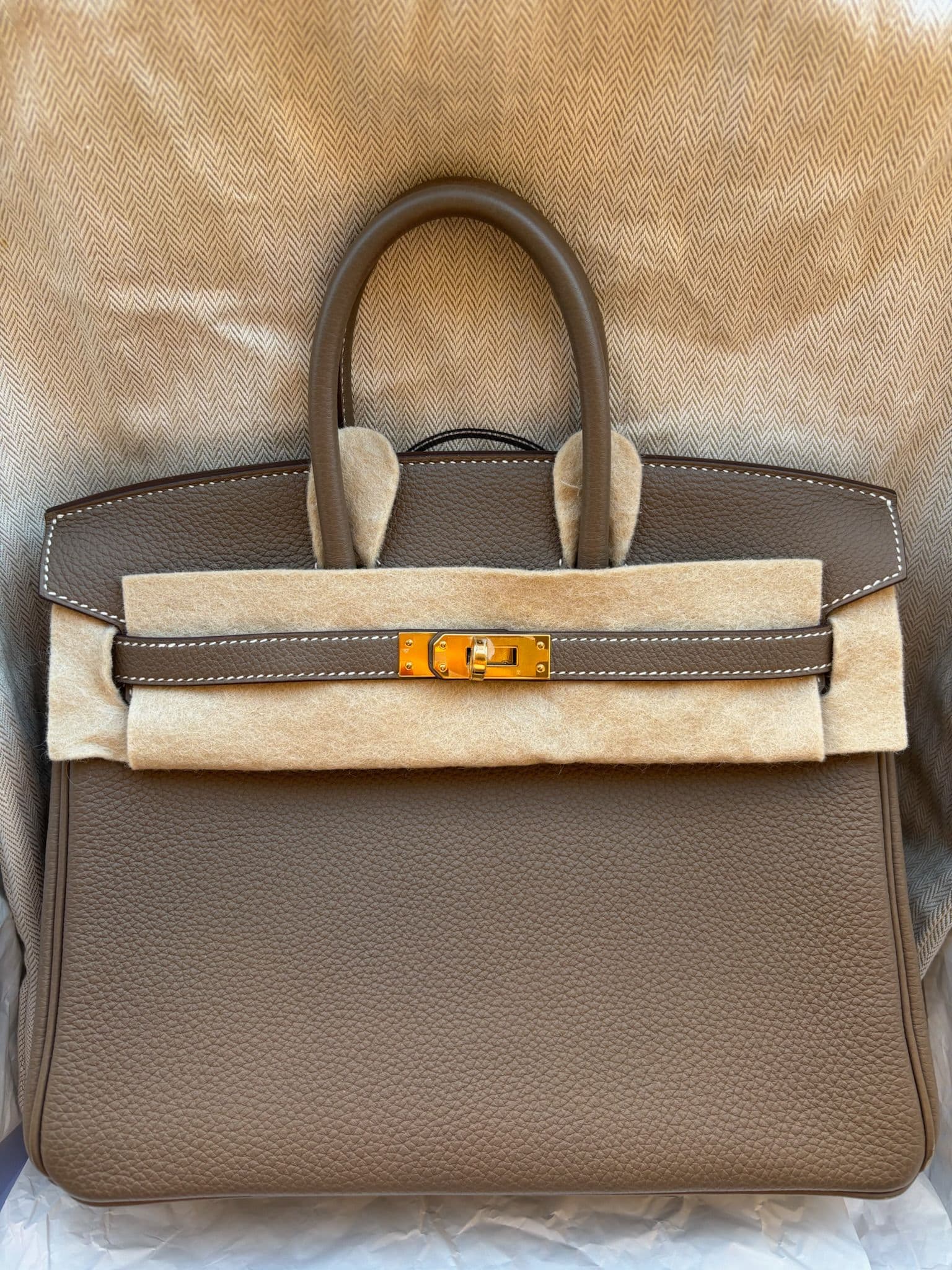 Hermès Birkin 25 in Etoupe Togo GHW hardware — front view