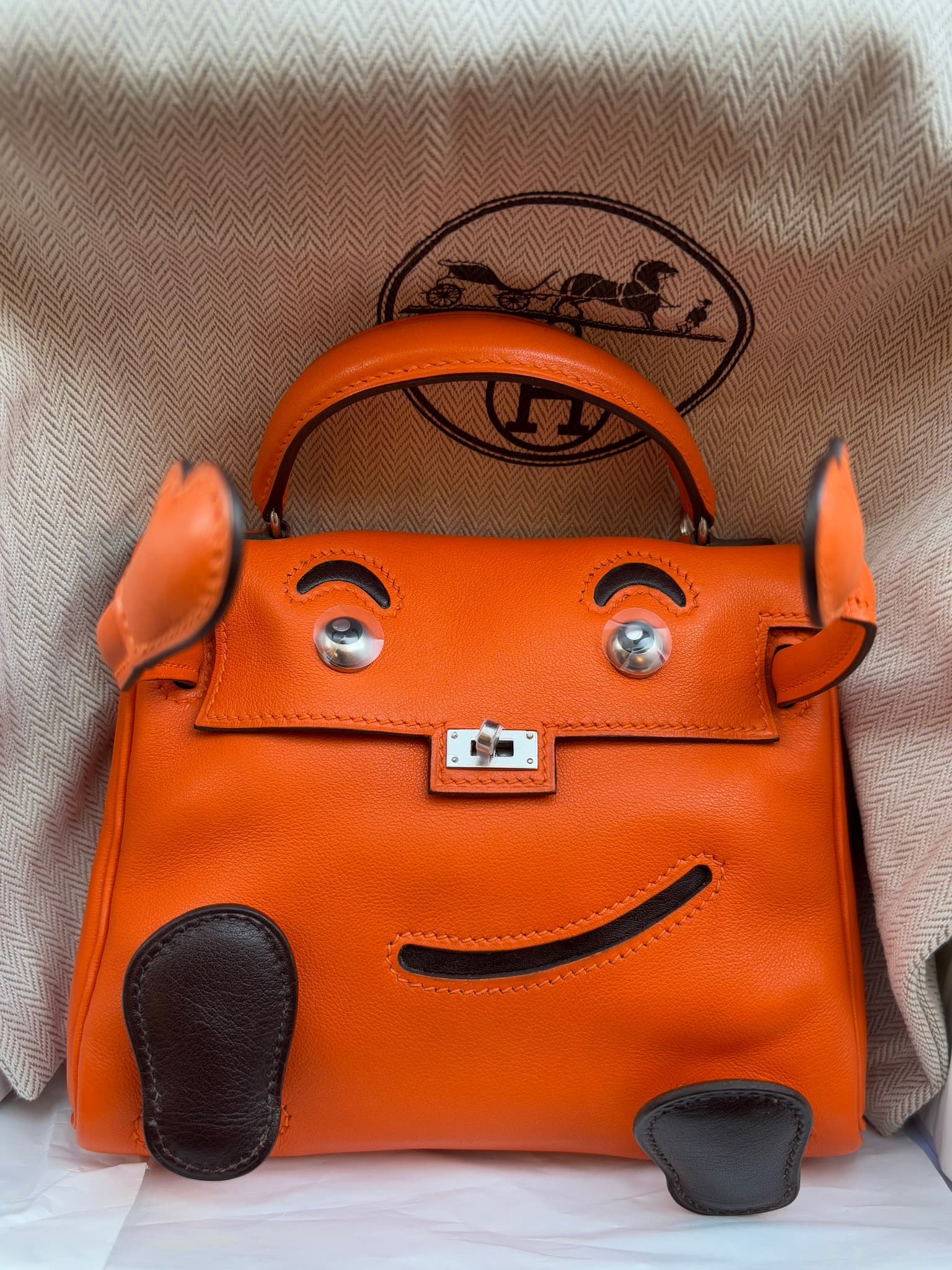Hermès Kelly Doll in Orange/Ebène Gulliver — front view