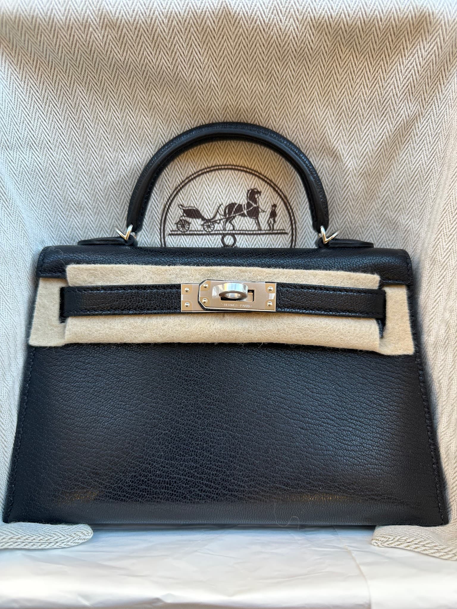 Hermès Mini Kelly in Black Chèvre PHW hardware — front view